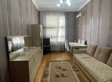 Satılır Nərimanov rayonu, Saatlı binanın düz yan